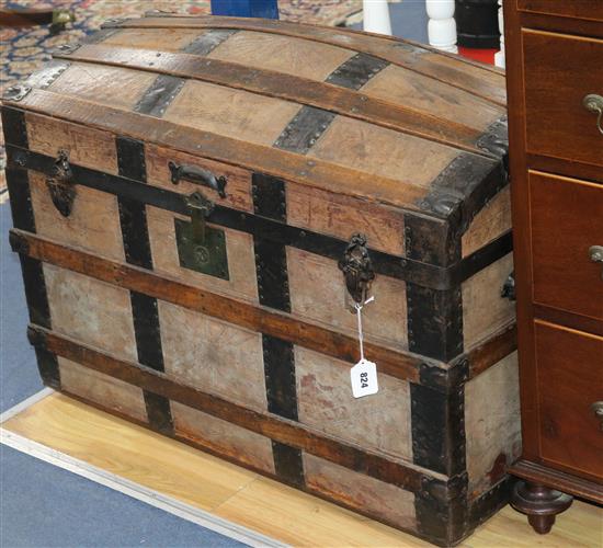 A leather and oak dome top trunk, W.88cm